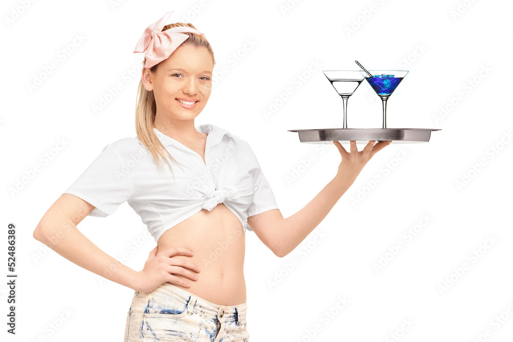Young waitress in short pants holding a tray with two cocktails Young waitress in short pants holding a tray with two cocktails