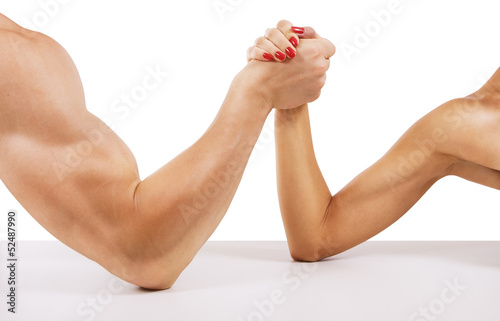 A man and woman with hands clasped arm wrestling, isolated on wh