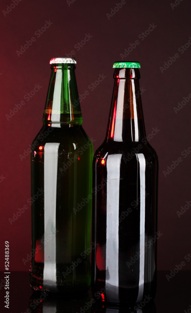Bottles of beer on brown background