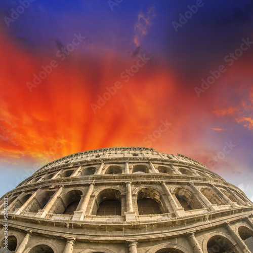 Beautiful sunset sky colors over Colosseum in Rome. Roma - Colos