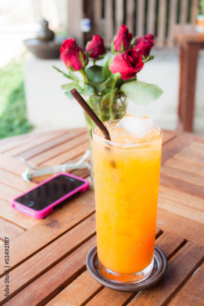 Relaxing time with fresh iced orange juice