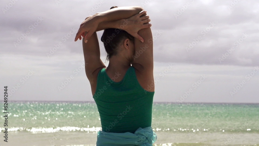 Woman standing on the beach, super slow motion, shot at 240fps Woman standing on the beach, super slow motion, shot at 240fps