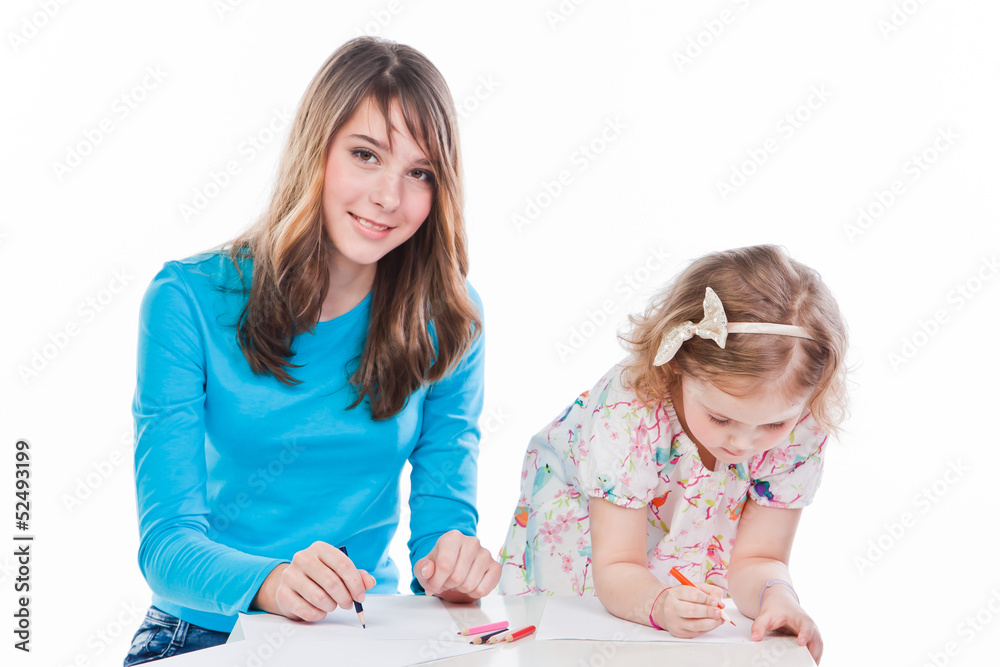 two beautiful girls draw with pencils two beautiful girls draw with pencils
