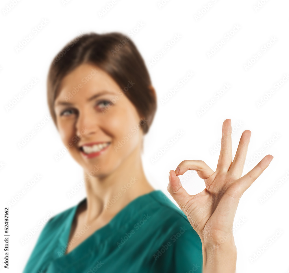 young woman doctor giving thumbs up sign