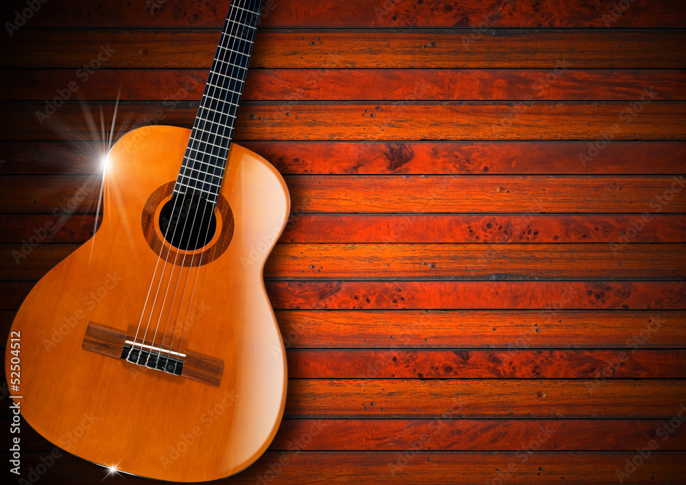 Obraz premium Acoustic Guitar on Wood Background