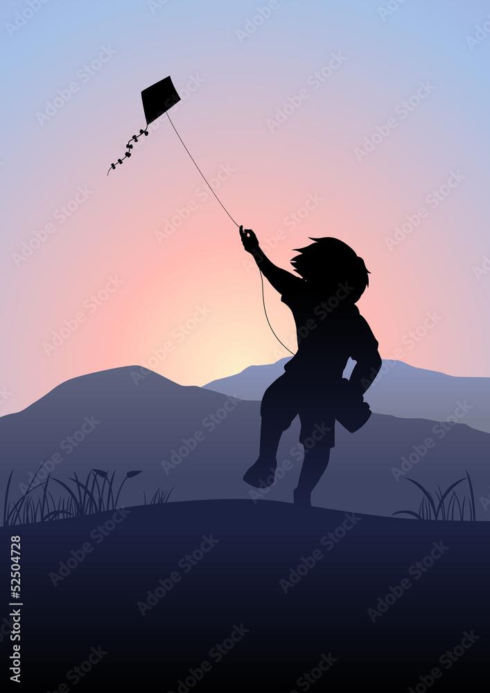 A boy playing a kite in the beautiful morning scene