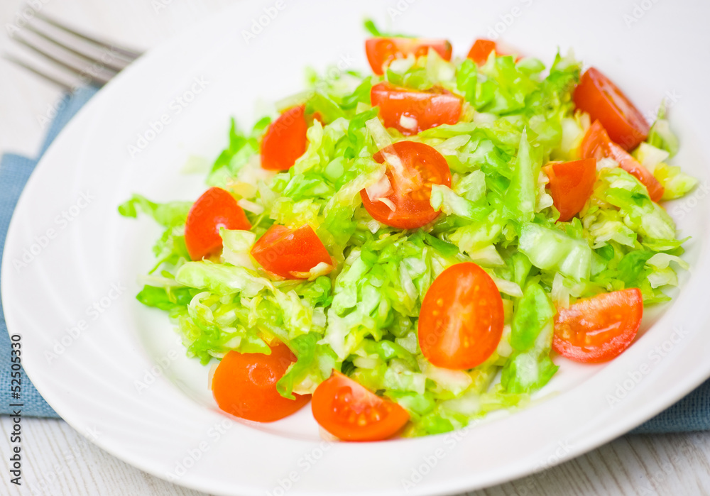 Fresh vegetable salad with cherry tomatoes and cabbage