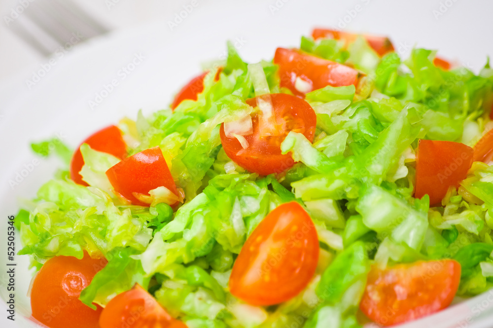 Fresh vegetable salad with cherry tomatoes and cabbage