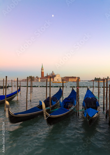 Gondolas at sunset with San Giorgio di Maggiore church, Venice, © Frank