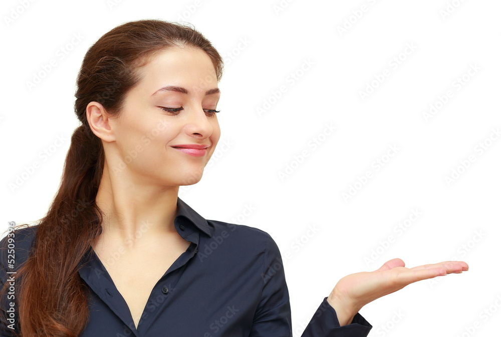 Happy smiling woman showing blank area on hand and looking isola Happy smiling woman showing blank area on hand and looking isola