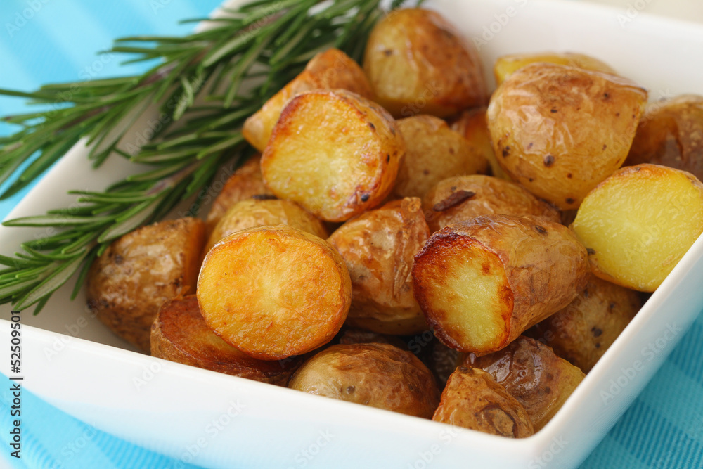 Roasted baby potatoes with fresh rosemary, close up Roasted baby potatoes with fresh rosemary, close up