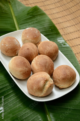 Round bread on banana leafs