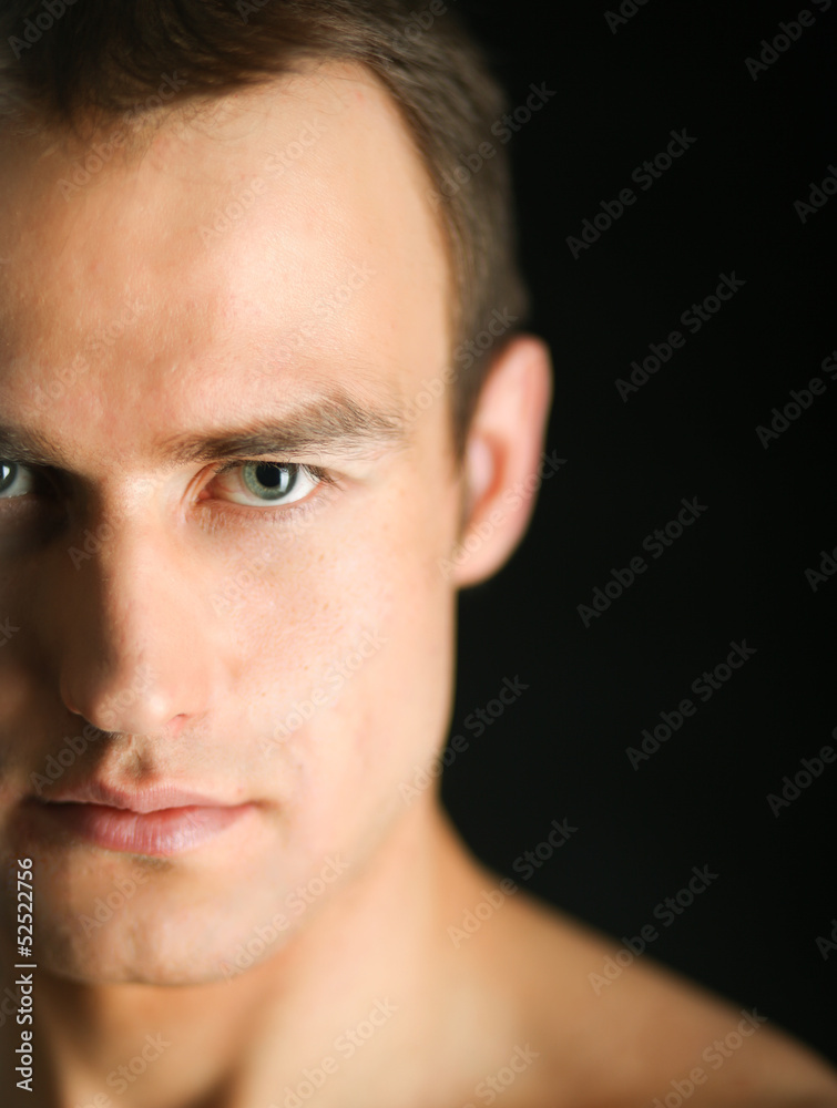 Portrait of a naked muscular man, isolated on black background Portrait of a naked muscular man, isolated on black background