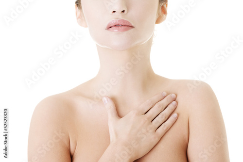 Beautiful sensual young woman touching her chest