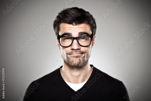 Portrait of a normal boy with rimmed glasses