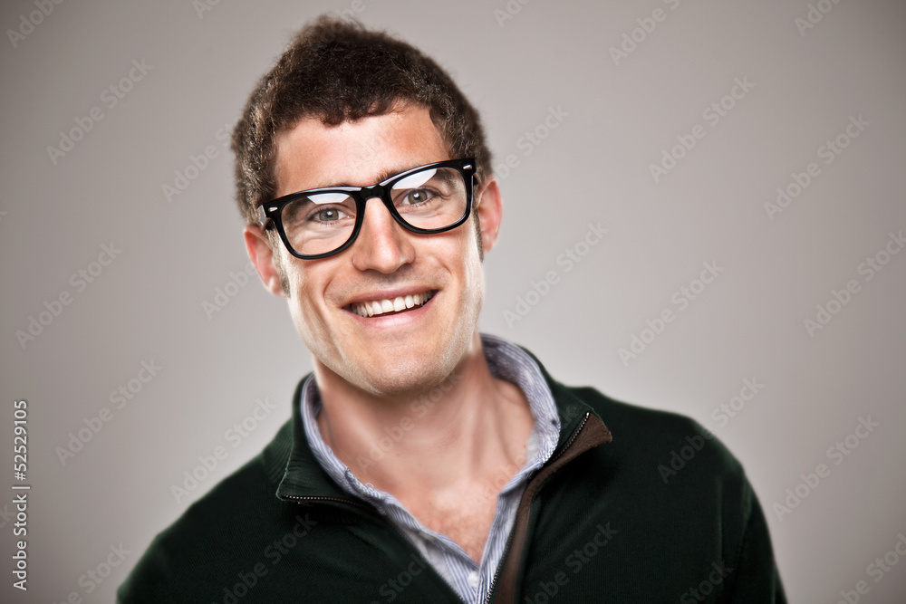 Portrait of a normal boy smiling over grey background. Portrait of a normal boy smiling over grey background.