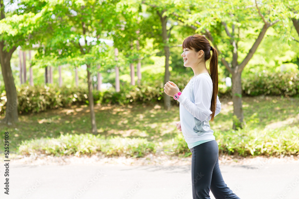 Beautiful young woman running in the park Beautiful young woman running in the park
