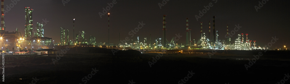 Big oil refinery at night