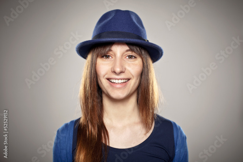 Portrait of a normal girl smiling with a blue hat © bonninturina