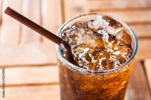 Cold glass with ice  black soda drink