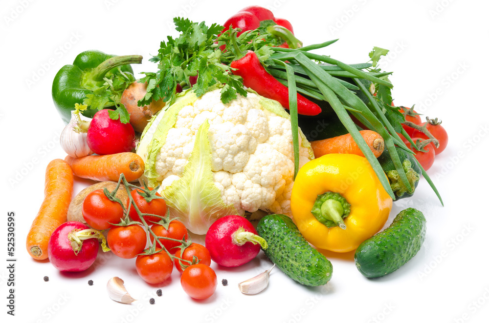 assorted fresh vegetables and greens on a white background assorted fresh vegetables and greens on a white background