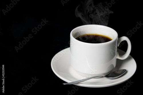 cup of coffee on a black background closeup