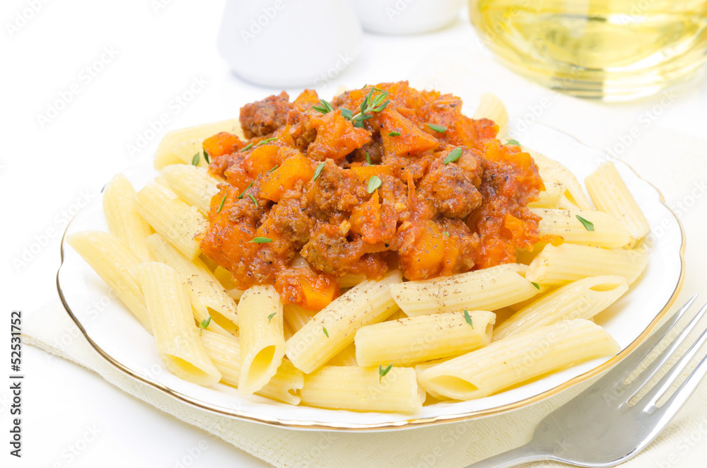 penne pasta with sauce of beef, tomato, pumpkin on the plate penne pasta with sauce of beef, tomato, pumpkin on the plate