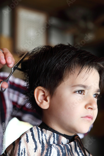 Young boy at barber shop