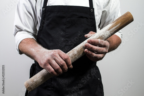 chef holding rolling pin