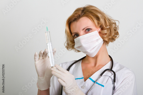 young and beautiful doctor in gloves