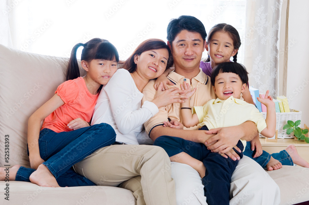 Indoor portrait of asian family