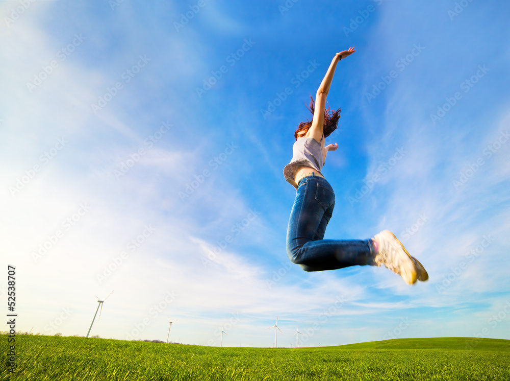 Young beautiful woman jumping for joy Young beautiful woman jumping for joy