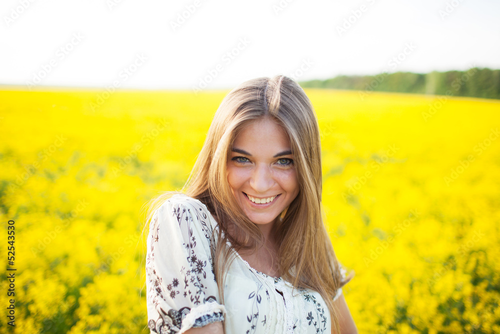 Sweet woman among yellow wildflowers in summer Sweet woman among yellow wildflowers in summer