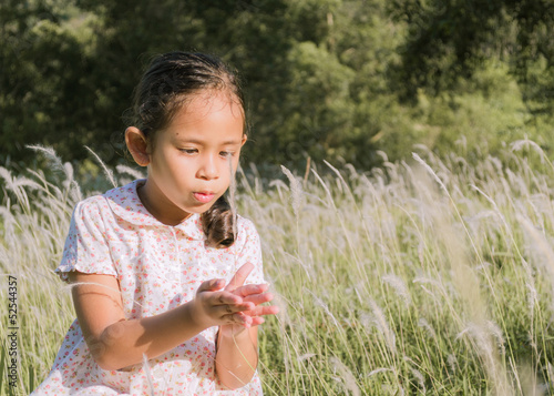 A cute girl on a field