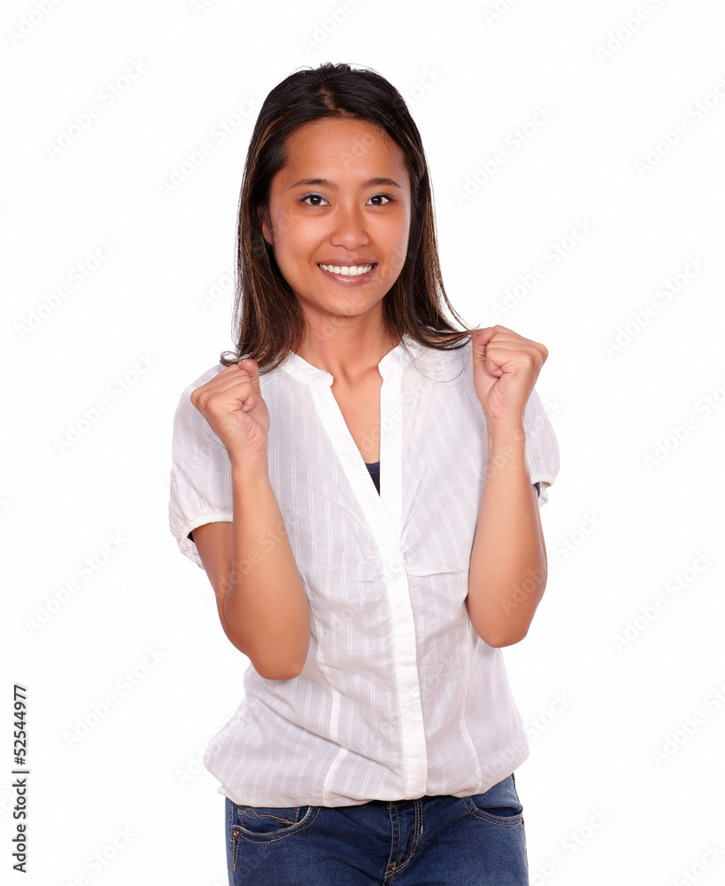 Charming asiatic young woman celebrating a victory Charming asiatic young woman celebrating a victory