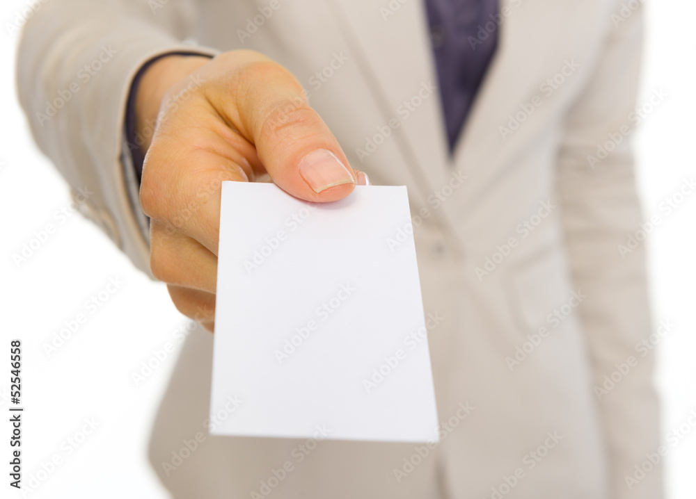 Closeup on business woman giving business card