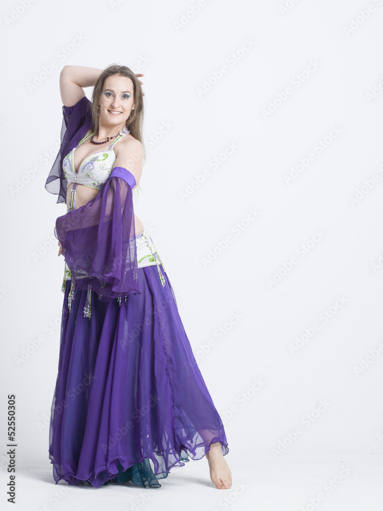 woman with curves dancing an oriental dance belly dancer