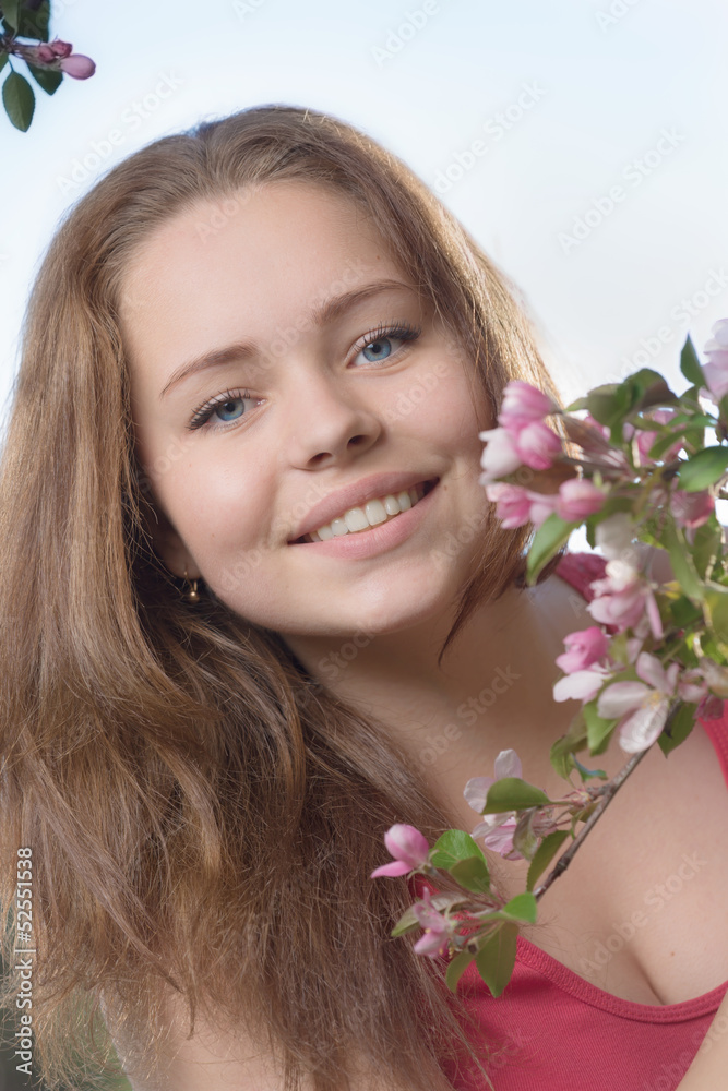 Portrait of the girl with a branch of a blossoming apple-tree Portrait of the girl with a branch of a blossoming apple-tree