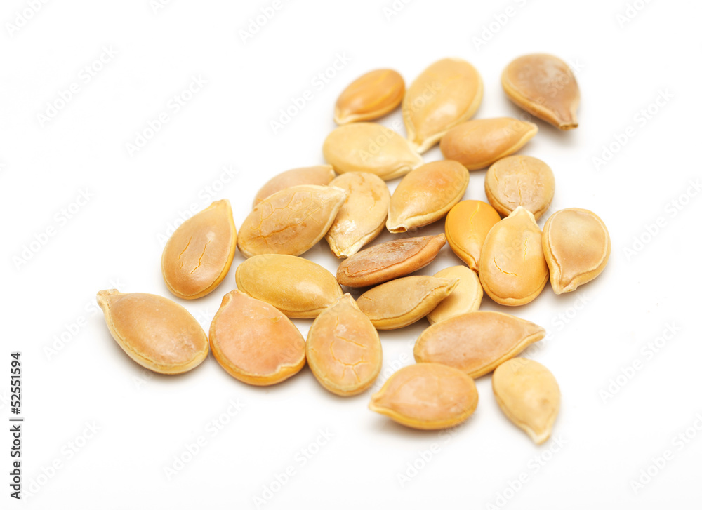 Pumpkin seeds on a white background. macro Pumpkin seeds on a white background. macro