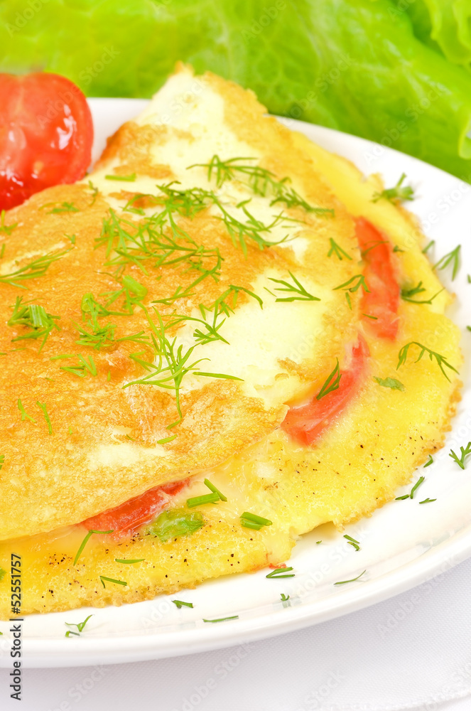 Omelet with herbs and vegetables, close up view Omelet with herbs and vegetables, close up view