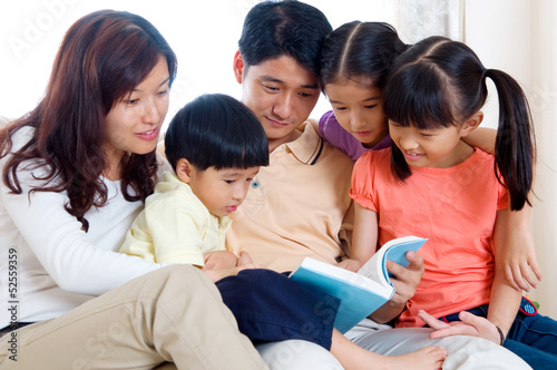 Asian famil reading