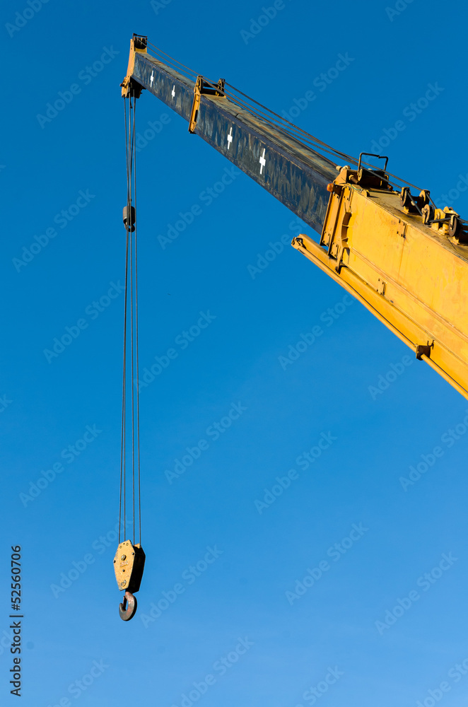 Yellow Tower crane with steel hook