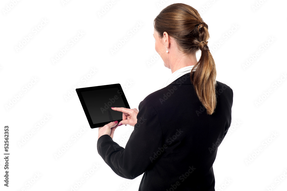 Business woman using a tablet device Business woman using a tablet device