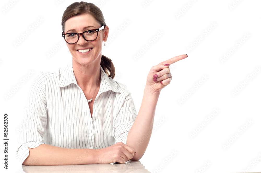 Pretty lady pointing away in different direction Pretty lady pointing away in different direction