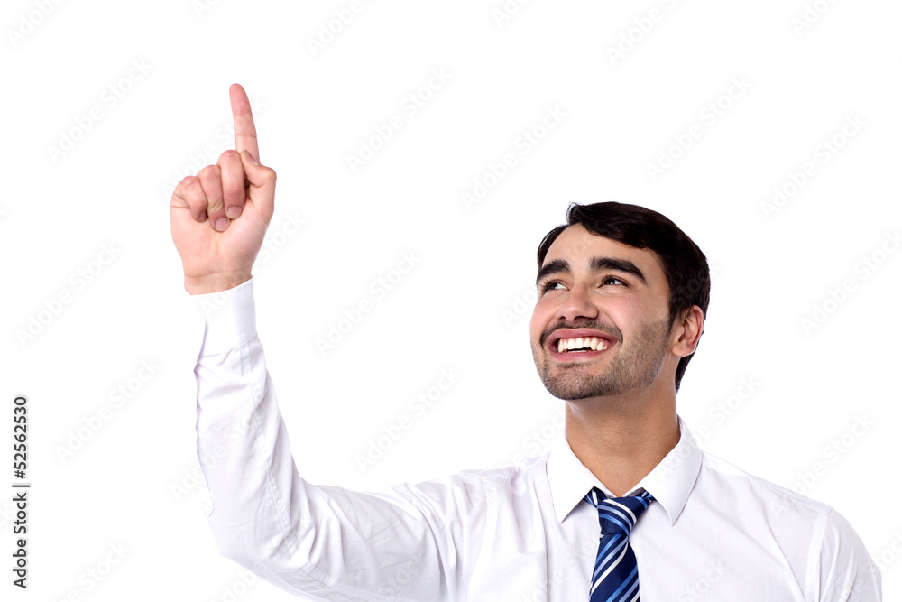 Cheerful male executive pointing upwards Cheerful male executive pointing upwards