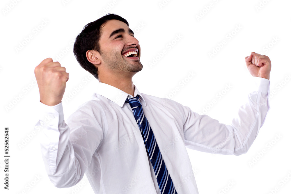 Excited businessman celebrates by pumping fists Excited businessman celebrates by pumping fists