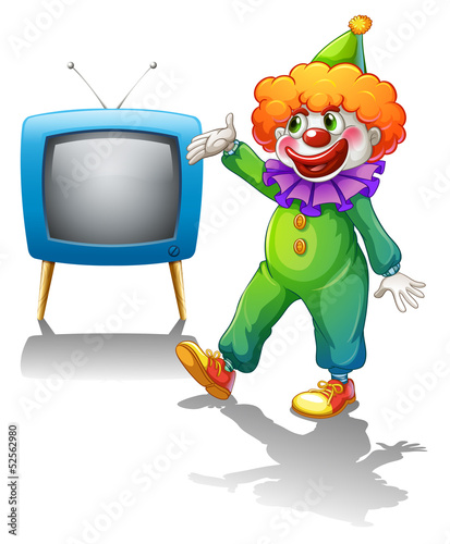 A clown standing in front of a television