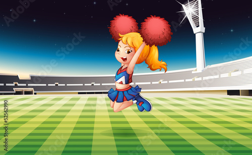 A soccer field with an energetic cheerdancer