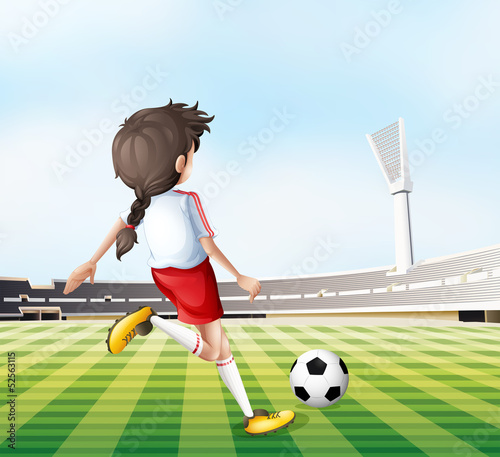 A young lady playing football