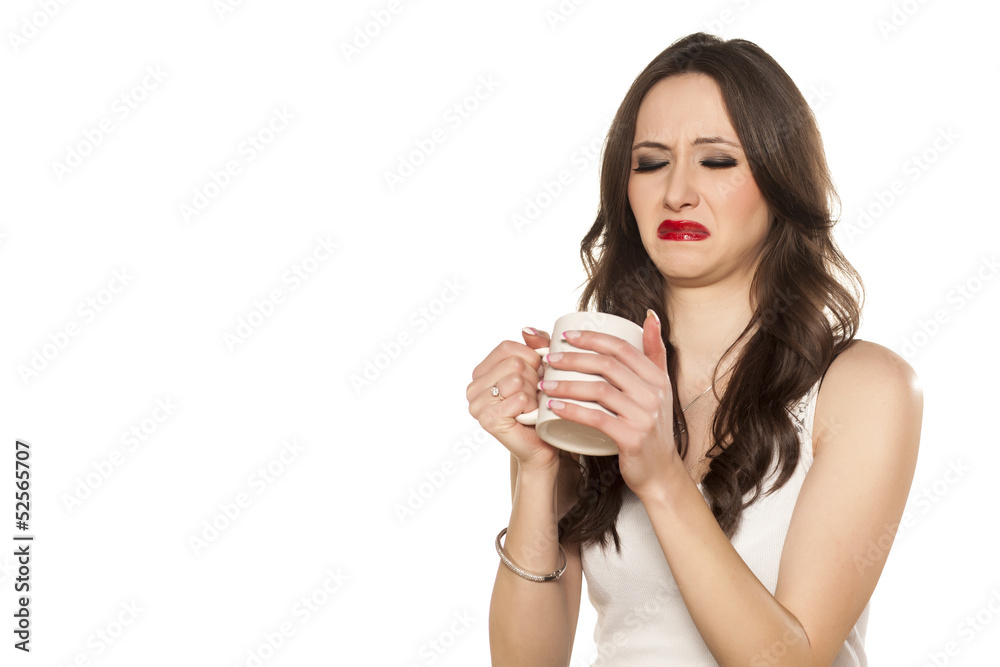girl makes a disgusting face and refusing to drink his tea girl makes a disgusting face and refusing to drink his tea